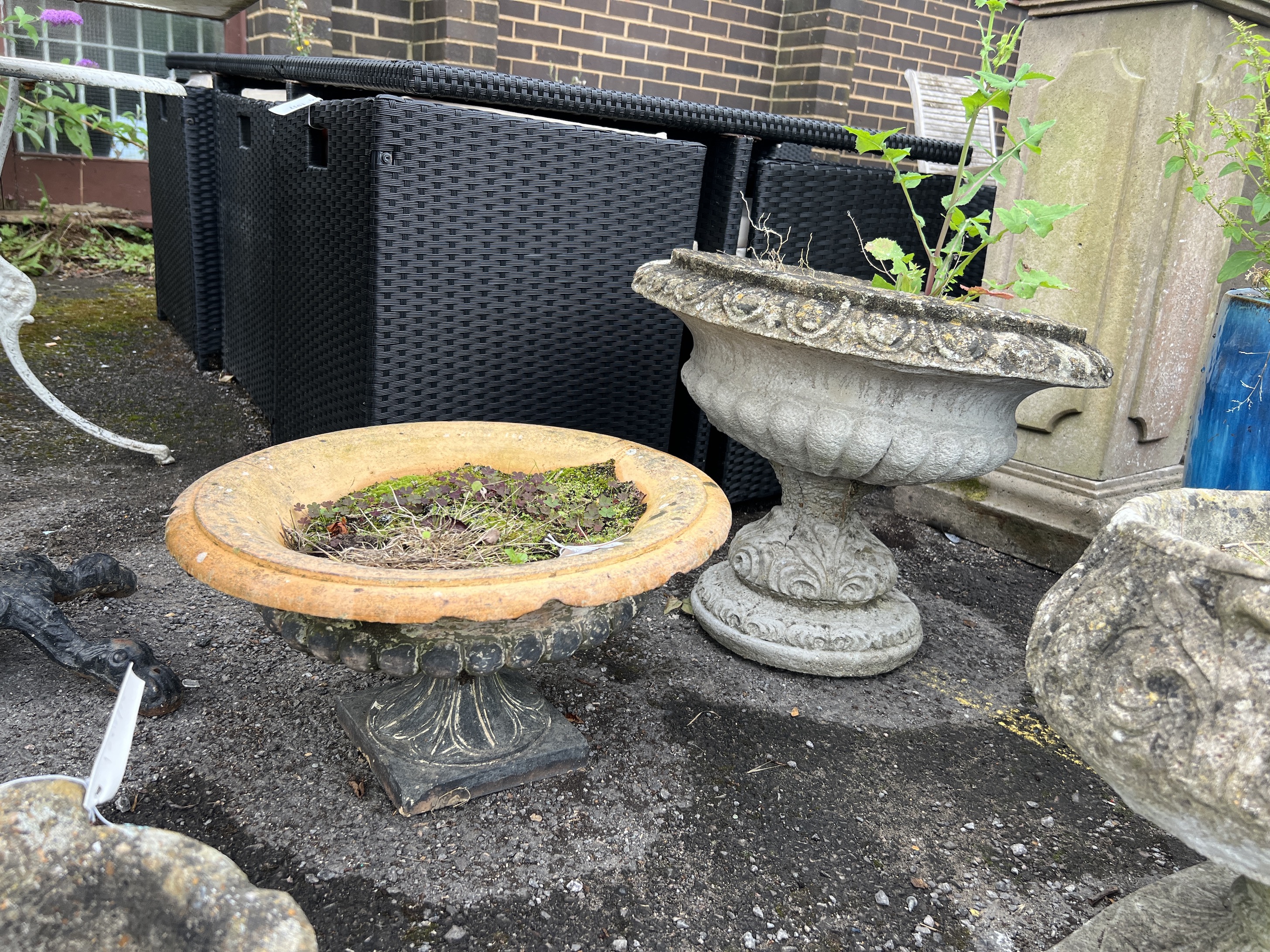 Two reconstituted stone and terracotta campana garden urns, larger diameter 55cm, height 46cm